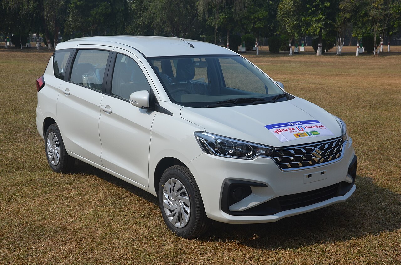 White Maruti Suzuki Ertiga, front three-quarter view